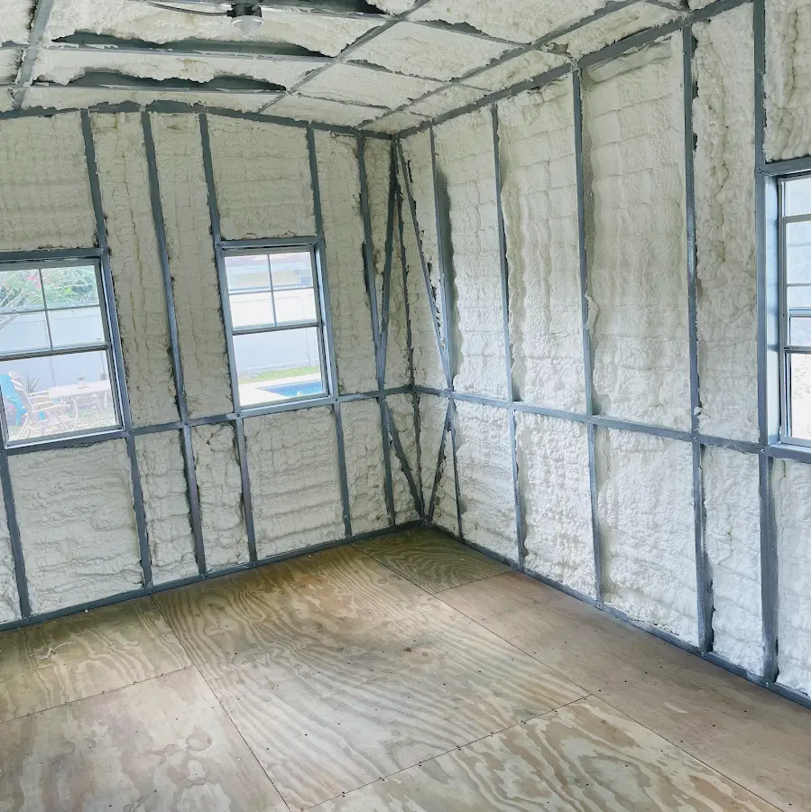 Closed-cell spray foam insulation applied to wall cavities in a residential project in Clinton
